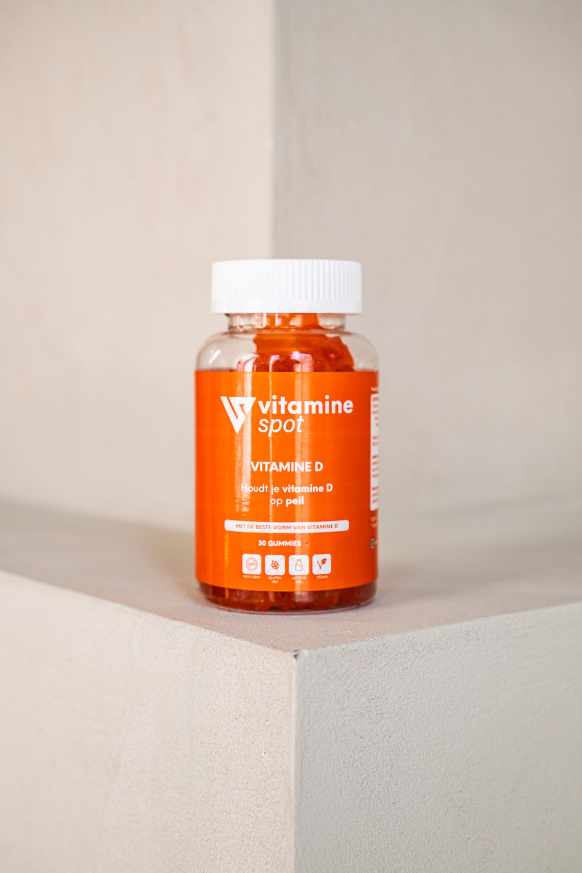 Vitamin D supplement bottle on a plain background