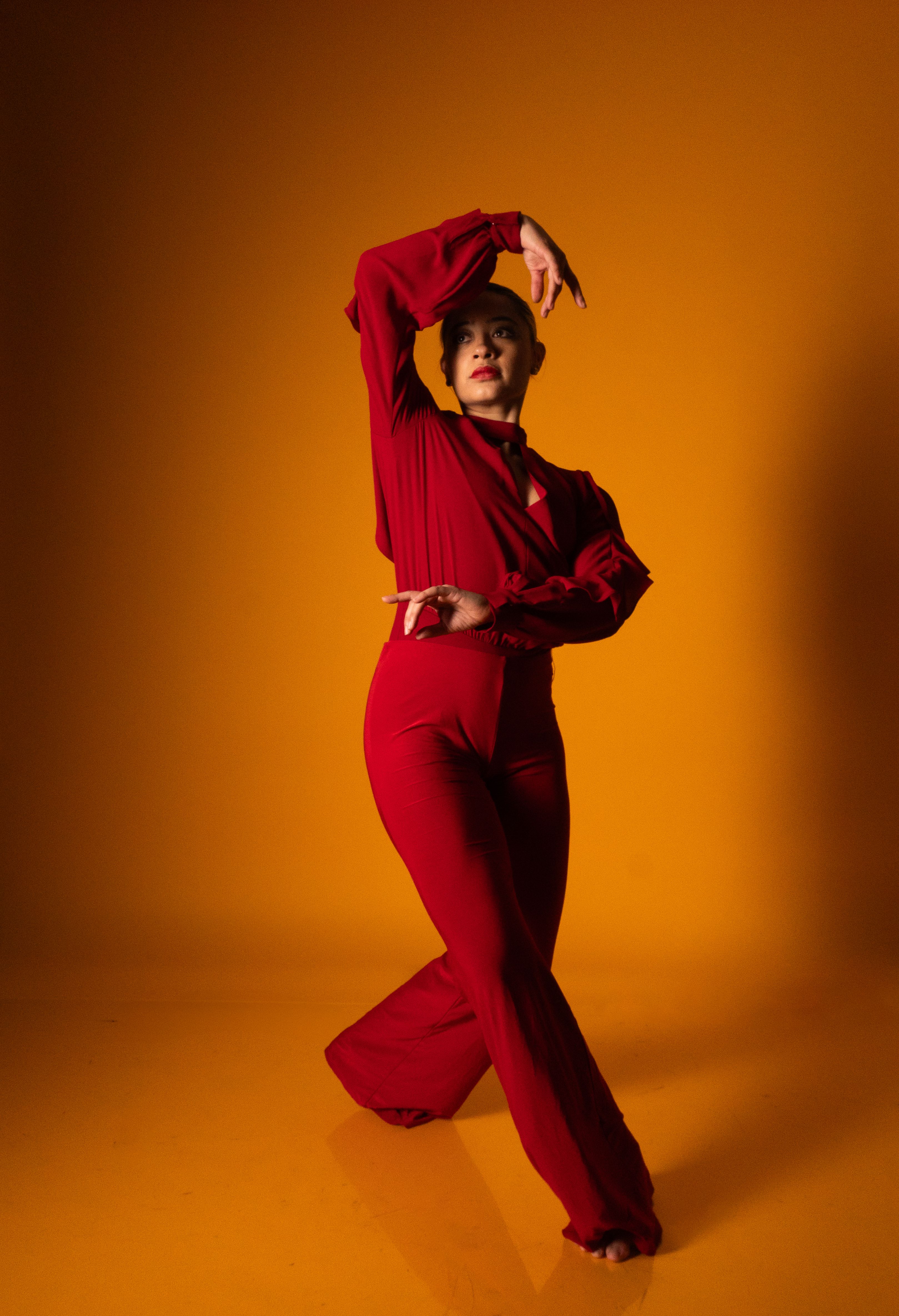 Elegant Female Dancer in Vibrant Red Pose · Free Stock Photo