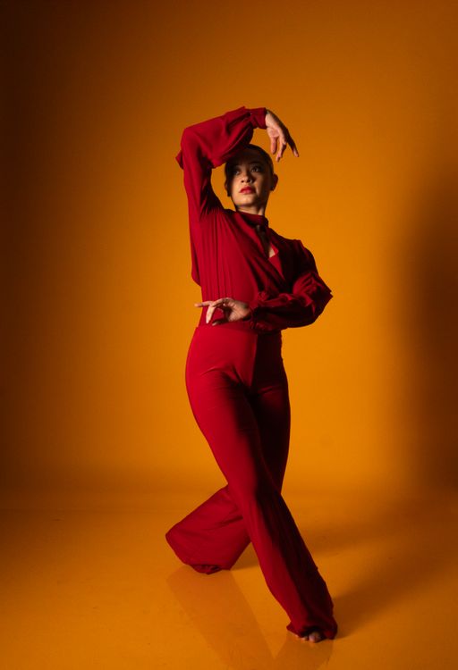 Elegant Female Dancer in Vibrant Red Pose · Free Stock Photo