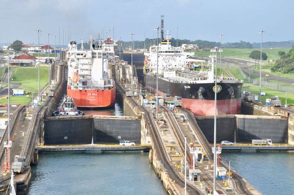 Large cargo ship transiting through the Miraflores Locks of the Panama Canal