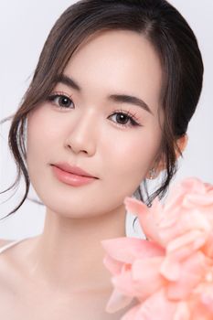 Elegant portrait of a young woman with pink flowers. Perfect for beauty and lifestyle content.