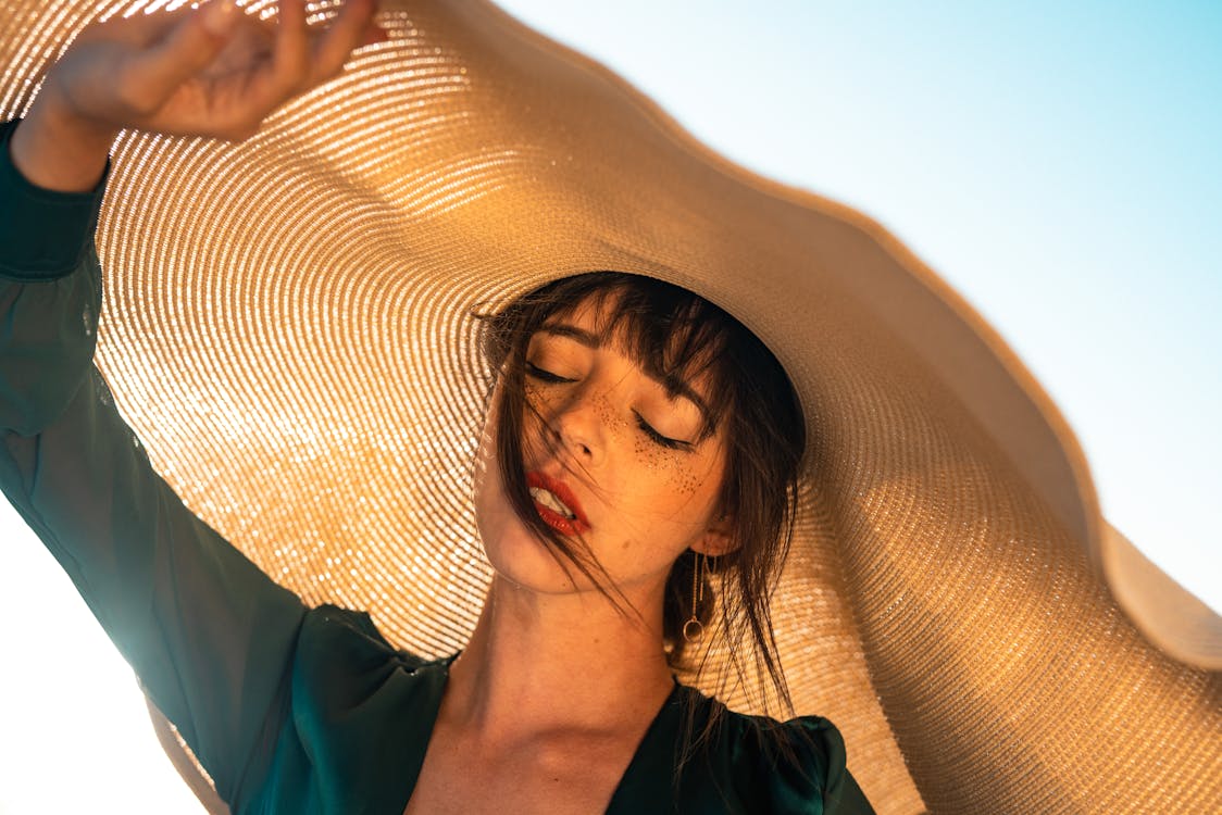 Woman Under Brown Hat