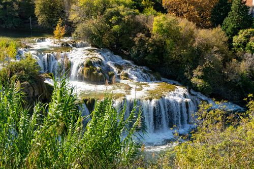 Free A picturesque view of waterfalls surrounded by lush greenery in Krka National Park, Croatia. Stock Photo