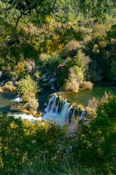 Explore the lush beauty of Krka National Park with its vibrant waterfalls and serene nature.