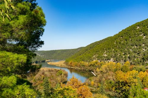 Free Beautiful autumn landscape of Krka River flowing through Gespanschaft Šibenik-Knin, Croatia. Stock Photo