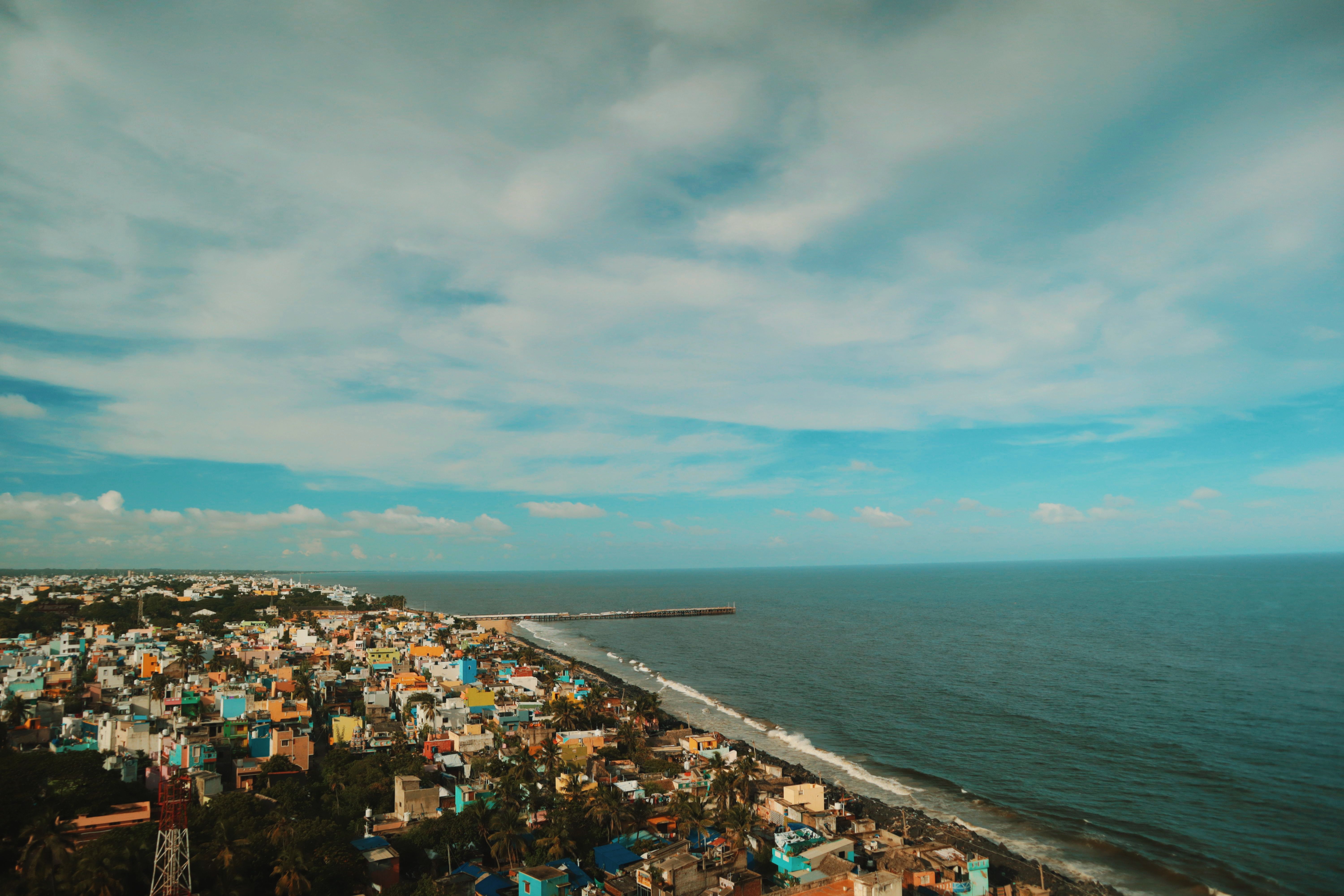 Scenic Coastal Town with Vibrant Houses · Free Stock Photo