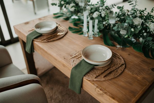 Styled event table with linens and greenery