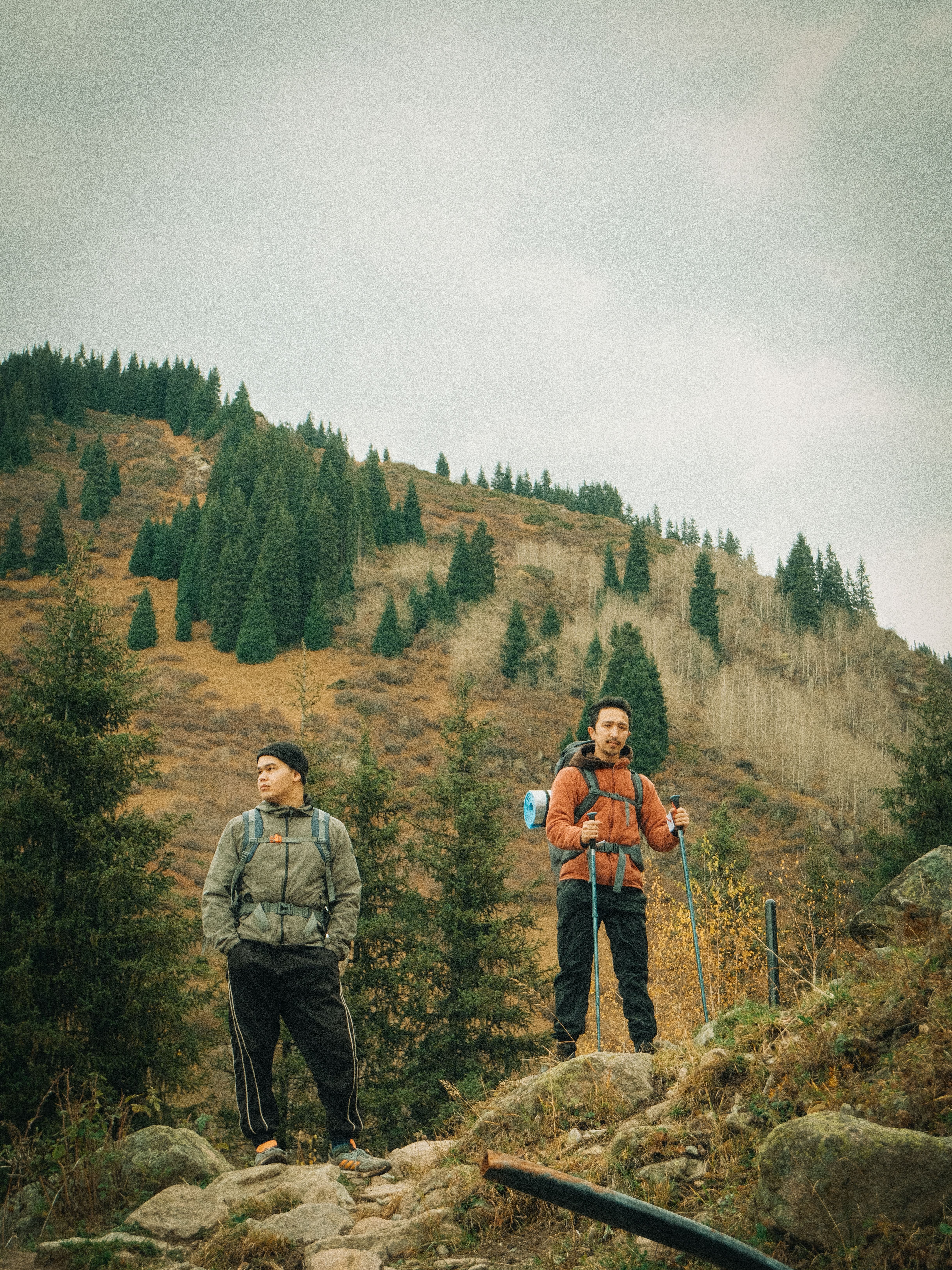 Hikers Exploring Scenic Mountain Landscape · Free Stock Photo