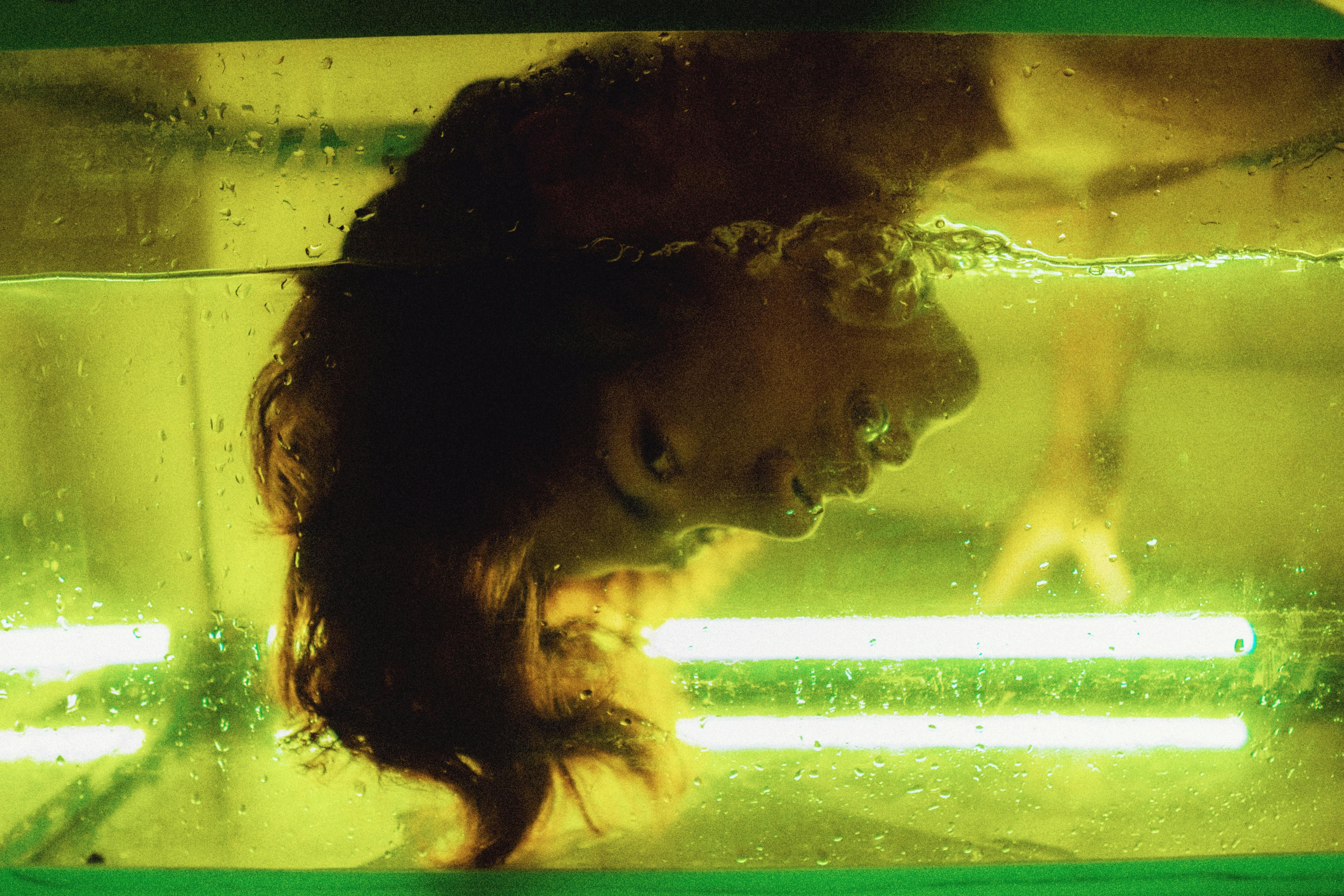 Woman's Head Submerged on Water