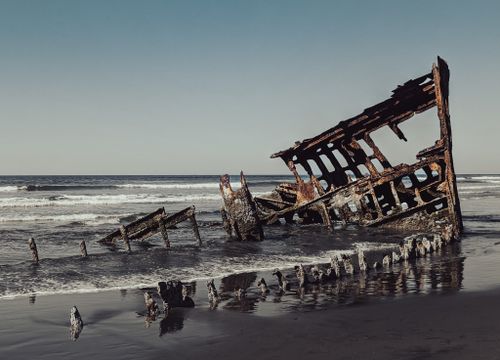 Free Explore the mysterious rusty shipwreck along the scenic Oregon coast, a must-see for travelers. Stock Photo