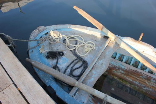 Close-up of a rustic wooden boat with ropes at Mina Harbor, Lebanon.