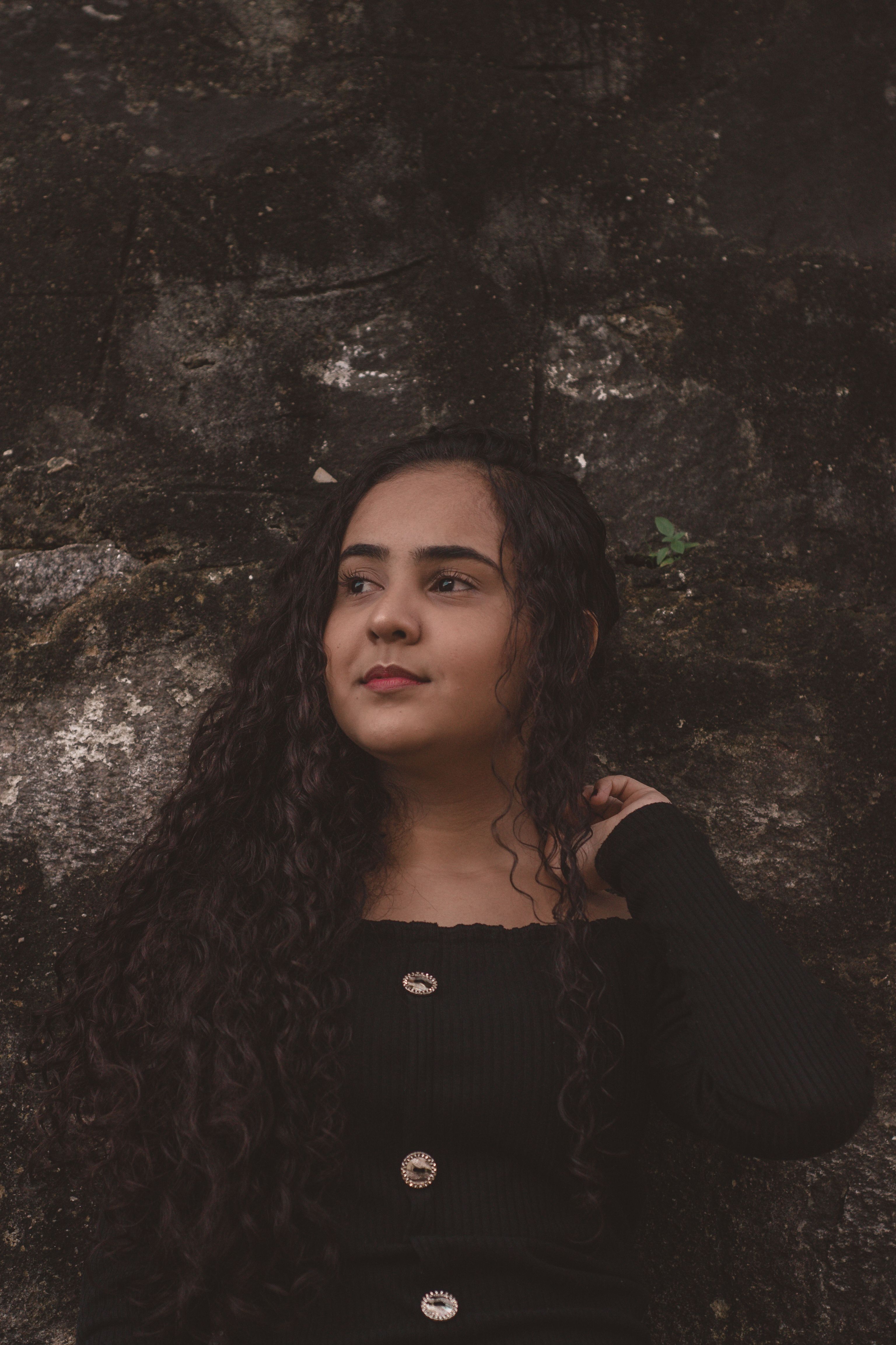 Portrait of a Woman with Curly Hair · Free Stock Photo