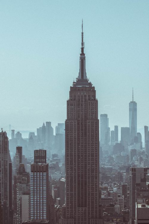 Free Skyline view of New York City featuring the Empire State Building on a clear day. Stock Photo