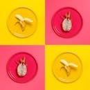 盘子上呈现着明亮多彩的香蕉和火龙果图像，充满活力，非常适合食品摄影