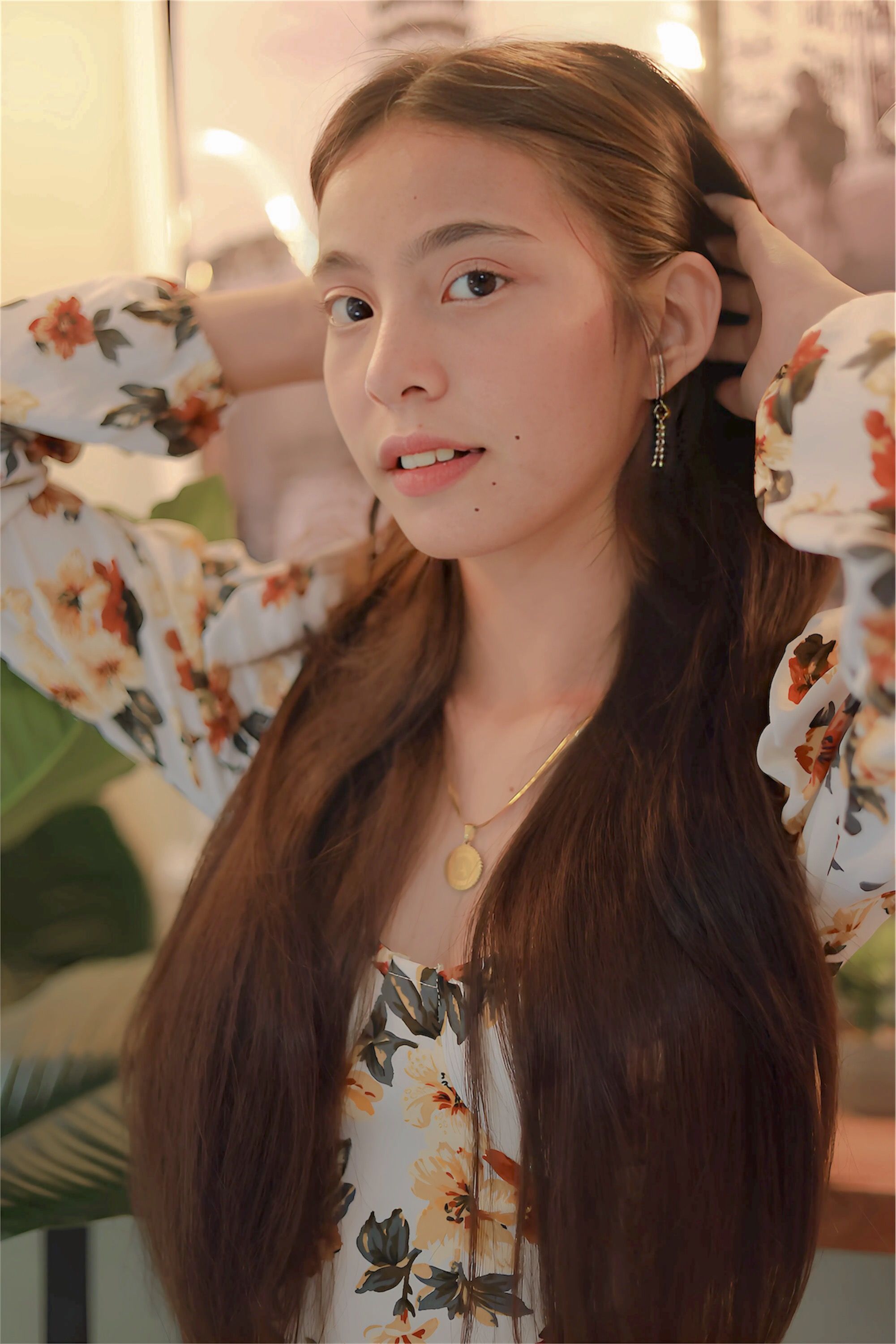 Elegant Portrait of a Woman in Floral Attire · Free Stock Photo