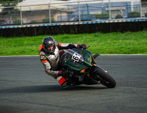 Free A motorcyclist leans into a turn on a racing track in Mabalacat, Philippines. Stock Photo