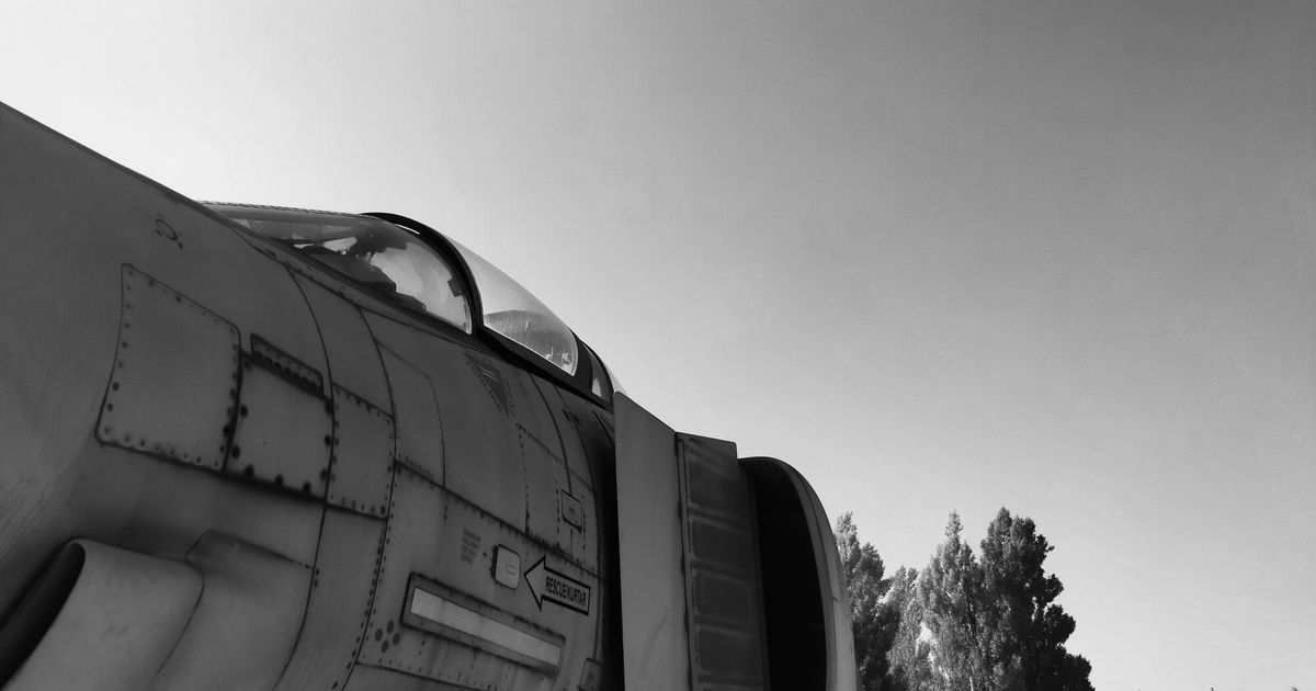 Black-and-white close-up of a jet fighter aircraft.