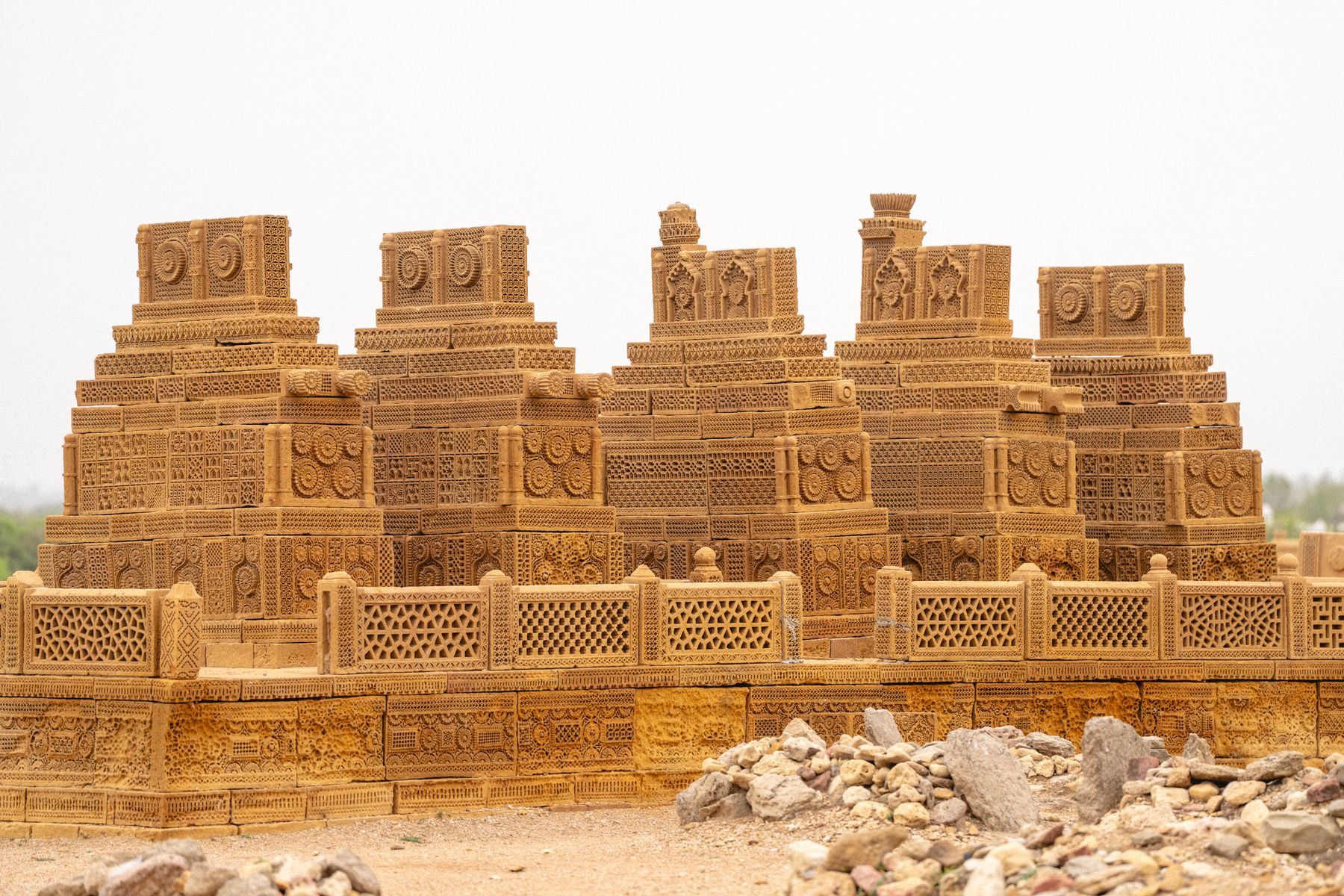 Stunning sandstone tombs with intricate carvings in Chaukhandi, Karachi, showcasing cultural heritage.
