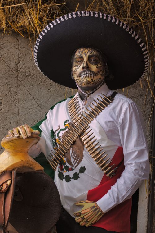 Free Man in Mexican skeleton costume with sombrero celebrates Dia de los Muertos. Stock Photo
