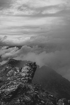 Breathtaking black and white landscape of rugged mountains and clouds in Trentino-Alto Adige, Italy.
