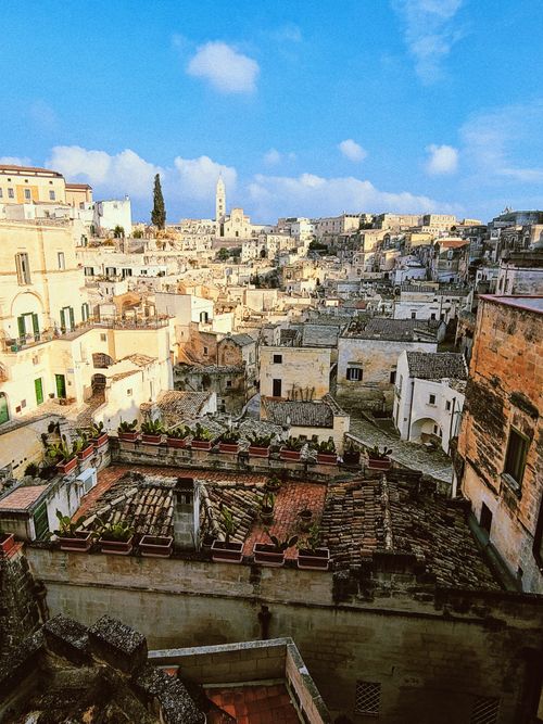 Free Charming view of Matera's ancient architecture under a clear blue sky in Basilicata, Italy. Stock Photo