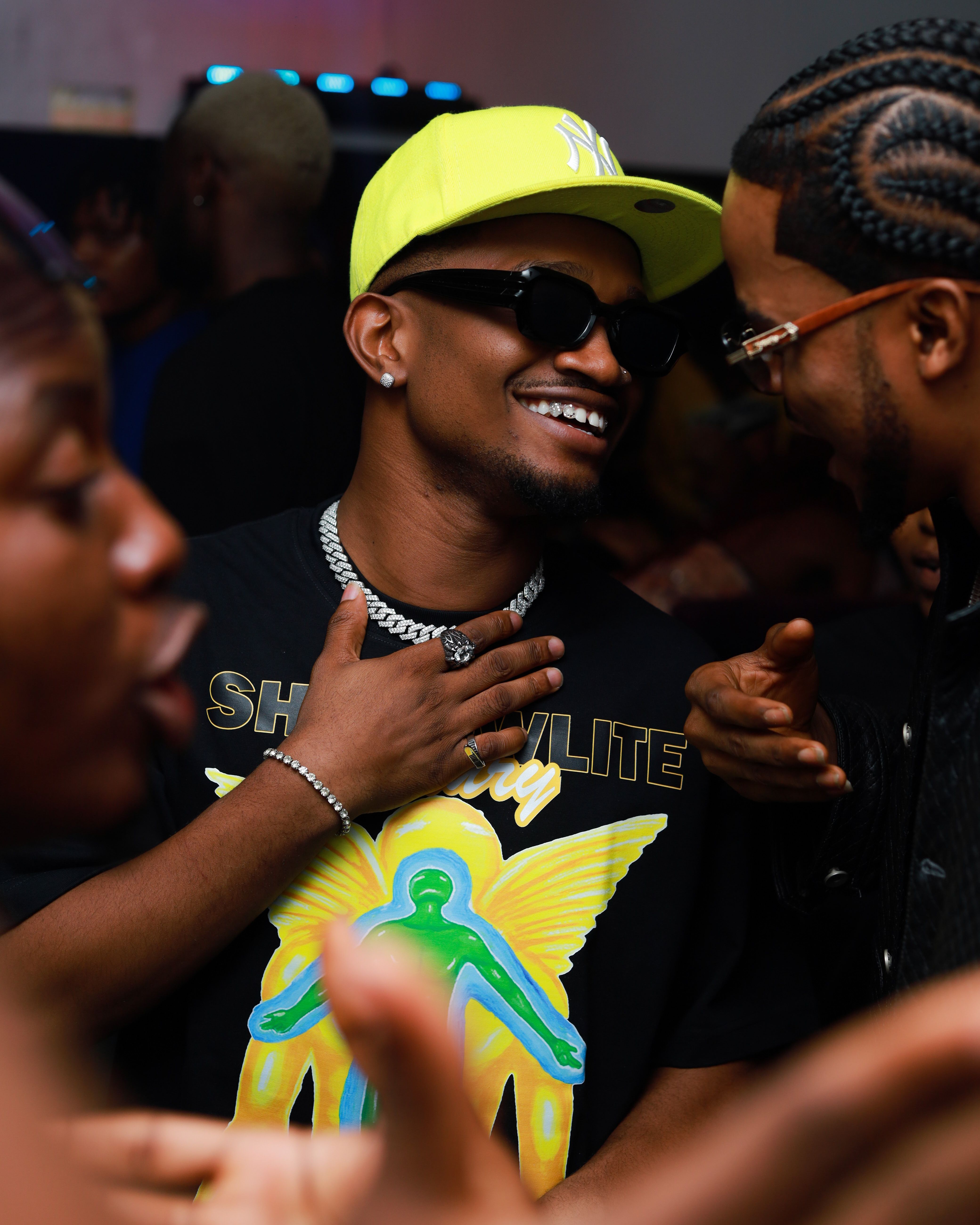 Young adults enjoying a vibrant nightlife party. Smiles, fashion, and friendship captured in a lively setting.