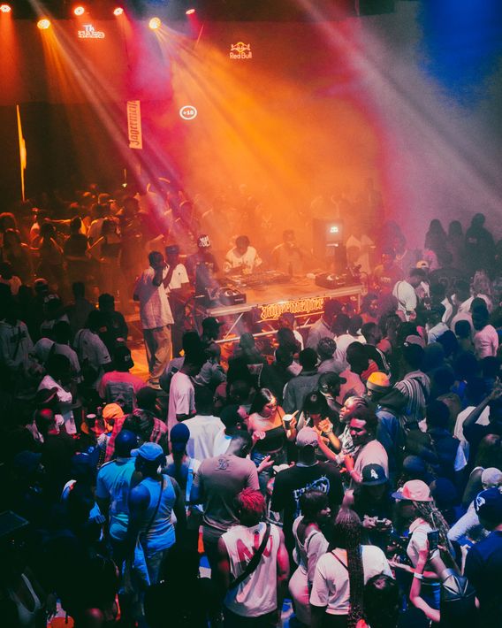 Nightclub crowd under stage lights — photo by Aj Collins Artistry on Pexels