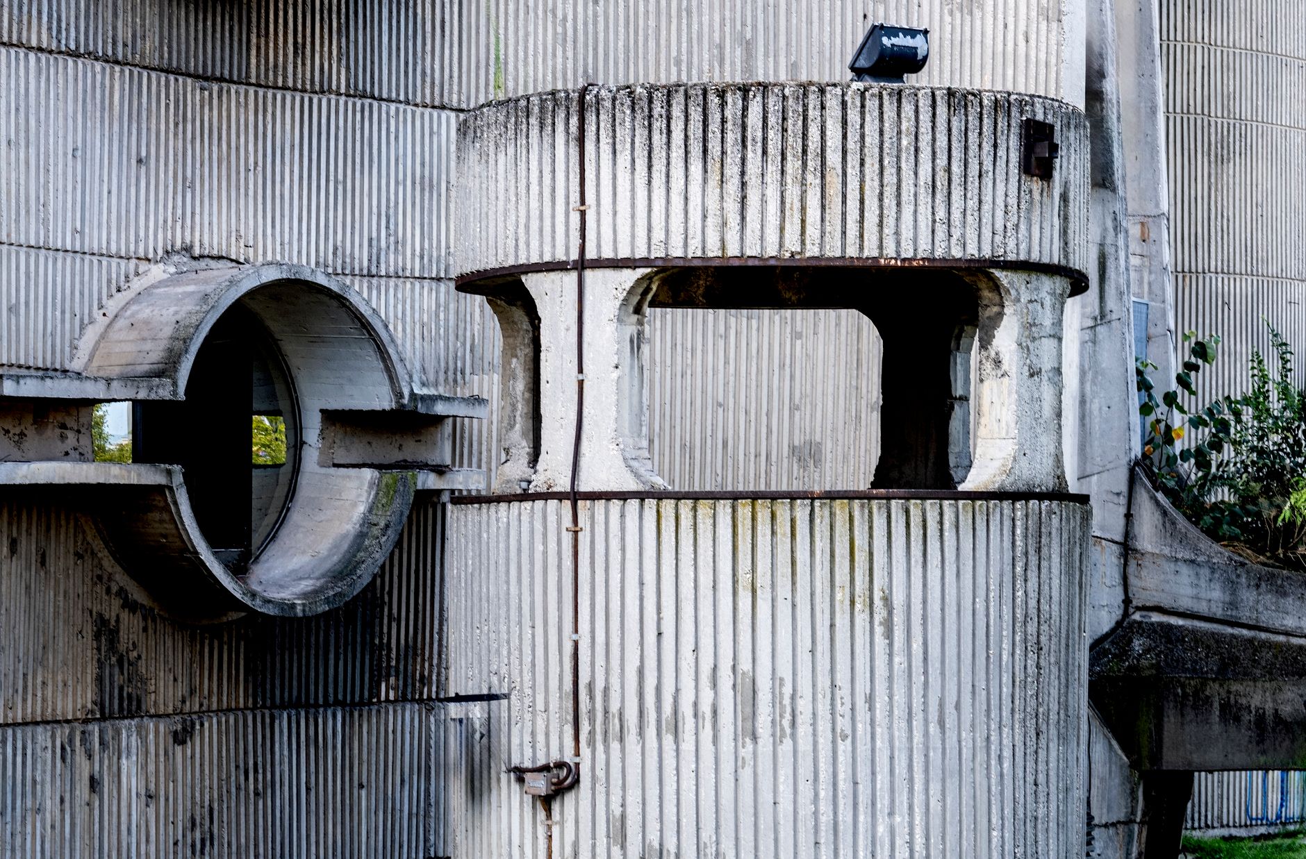 Close-up of a Brutalist concrete structure with circular details in Skopje, North Macedonia.. pexels, close, brutalist