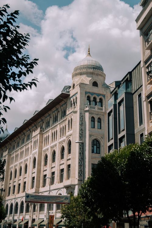 Free Stunning view of the Legacy Ottoman Hotel's architectural beauty in Istanbul under a cloudy sky. Stock Photo