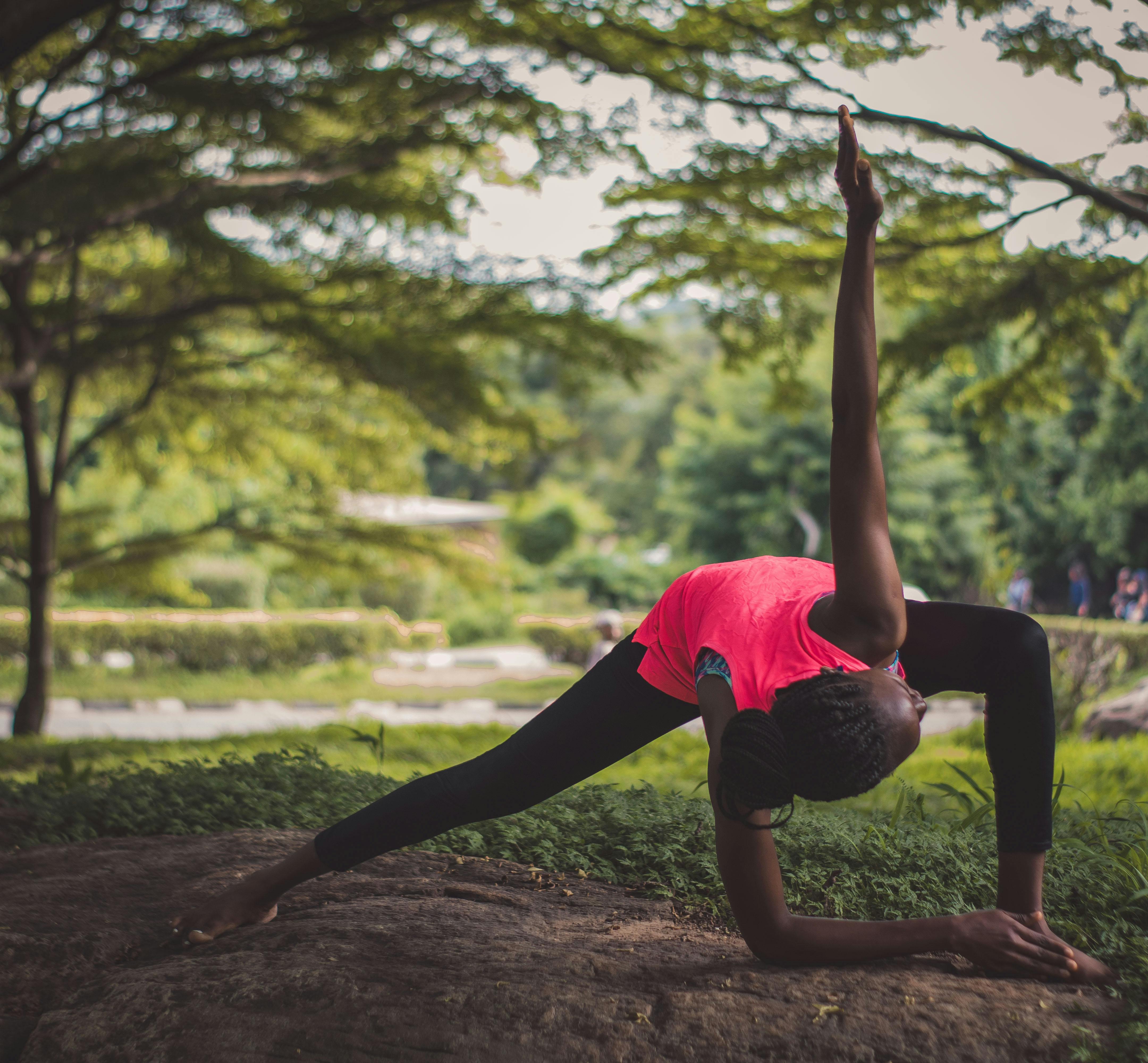 Lady in Pink Tank Top Doing a Yoga Pose · Free Stock Photo