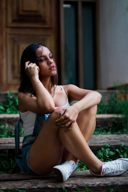 Woman Sitting on Wooden Bench