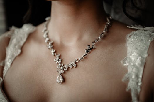 Close-up of a woman wearing a floral design wedding necklace, exuding elegance.
