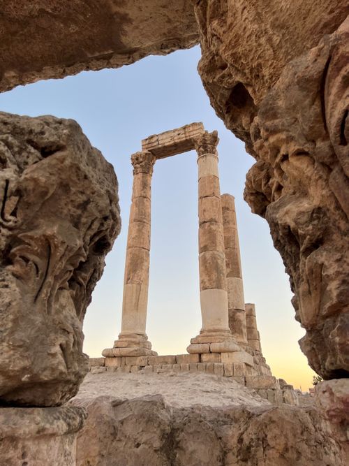 Free View of ancient Roman columns framed by stone at Amman Citadel, Jordan. Stock Photo