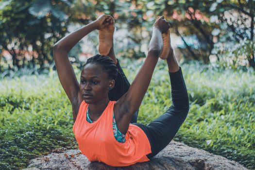 Woman Doing Yoga on Rock