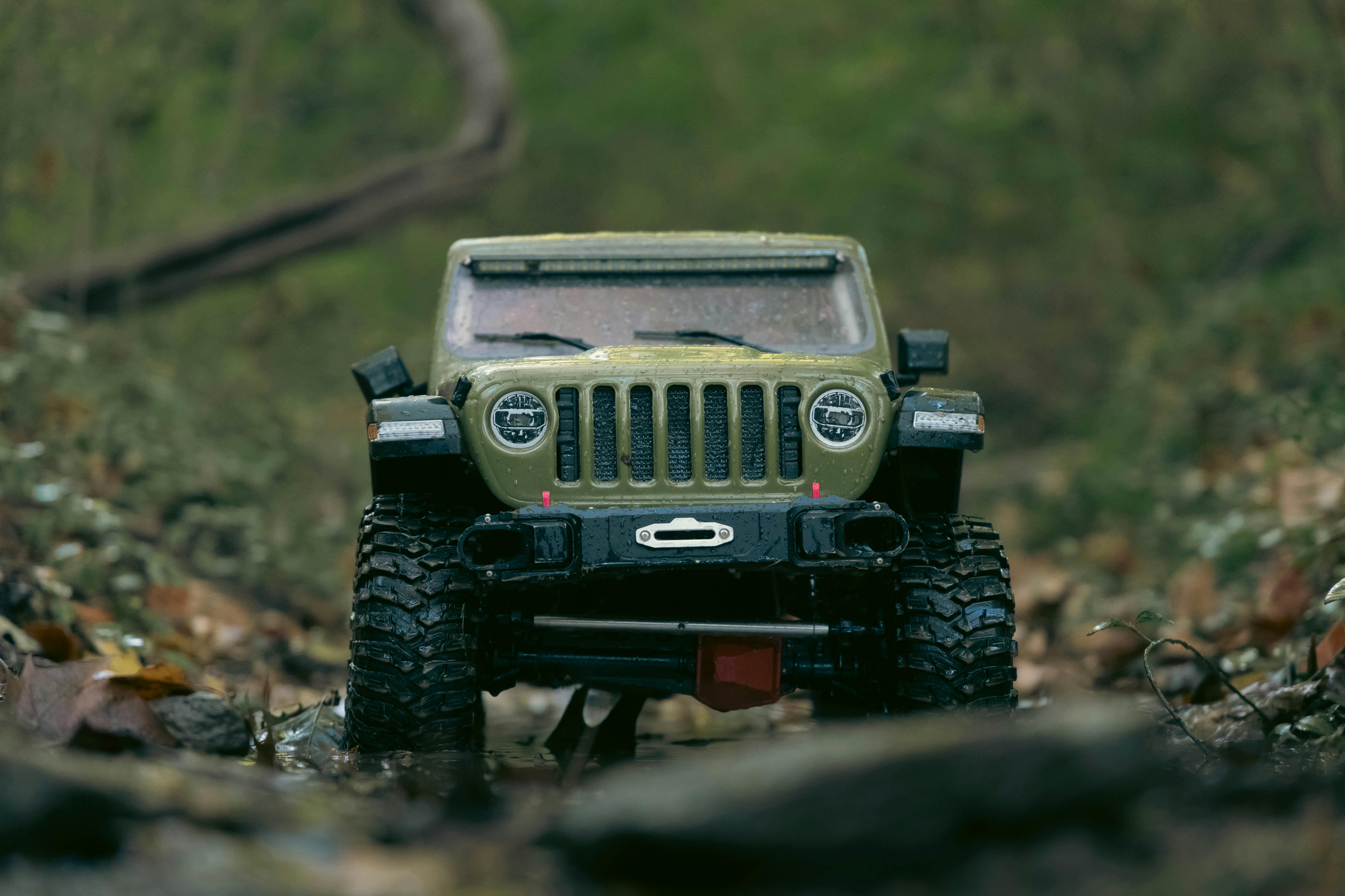 Toy jeep navigating a rugged forest path, showcasing adventure and exploration.