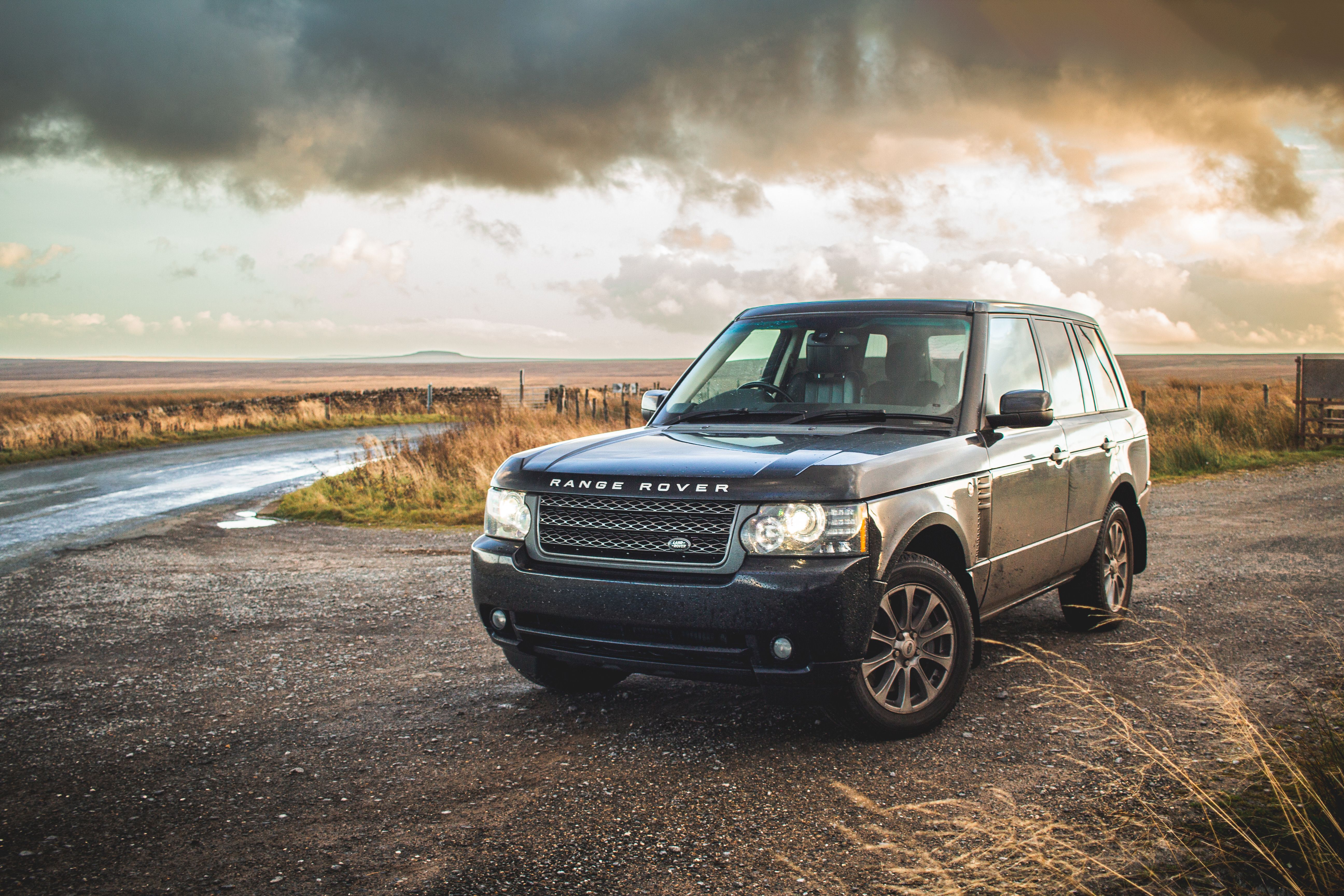 Elegant Range Rover on Scenic Rural Road · Free Stock Photo