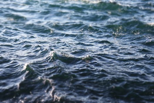 Close-up image of dynamic ocean waves under a bright blue sky., free online jigsaw puzzle on JigsawPuzzlesFreeOnline.org