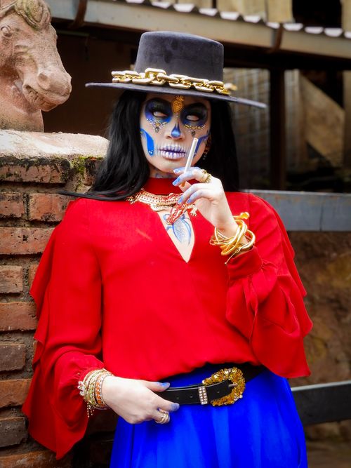 Free A colorful Catrina dressed in red and blue, celebrating Day of the Dead. Stock Photo