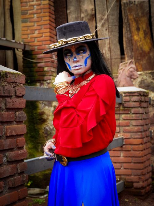 Free Colorful portrait of a woman celebrating Day of the Dead with traditional makeup. Stock Photo