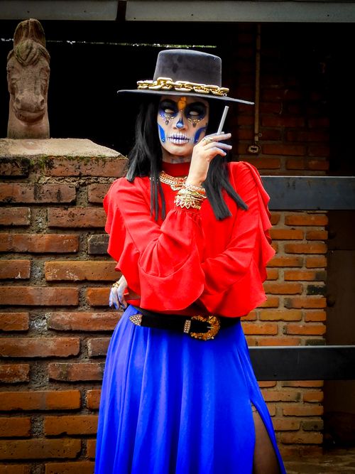 Free Colorful Day of the Dead celebration featuring traditional Catrina makeup and costume. Stock Photo