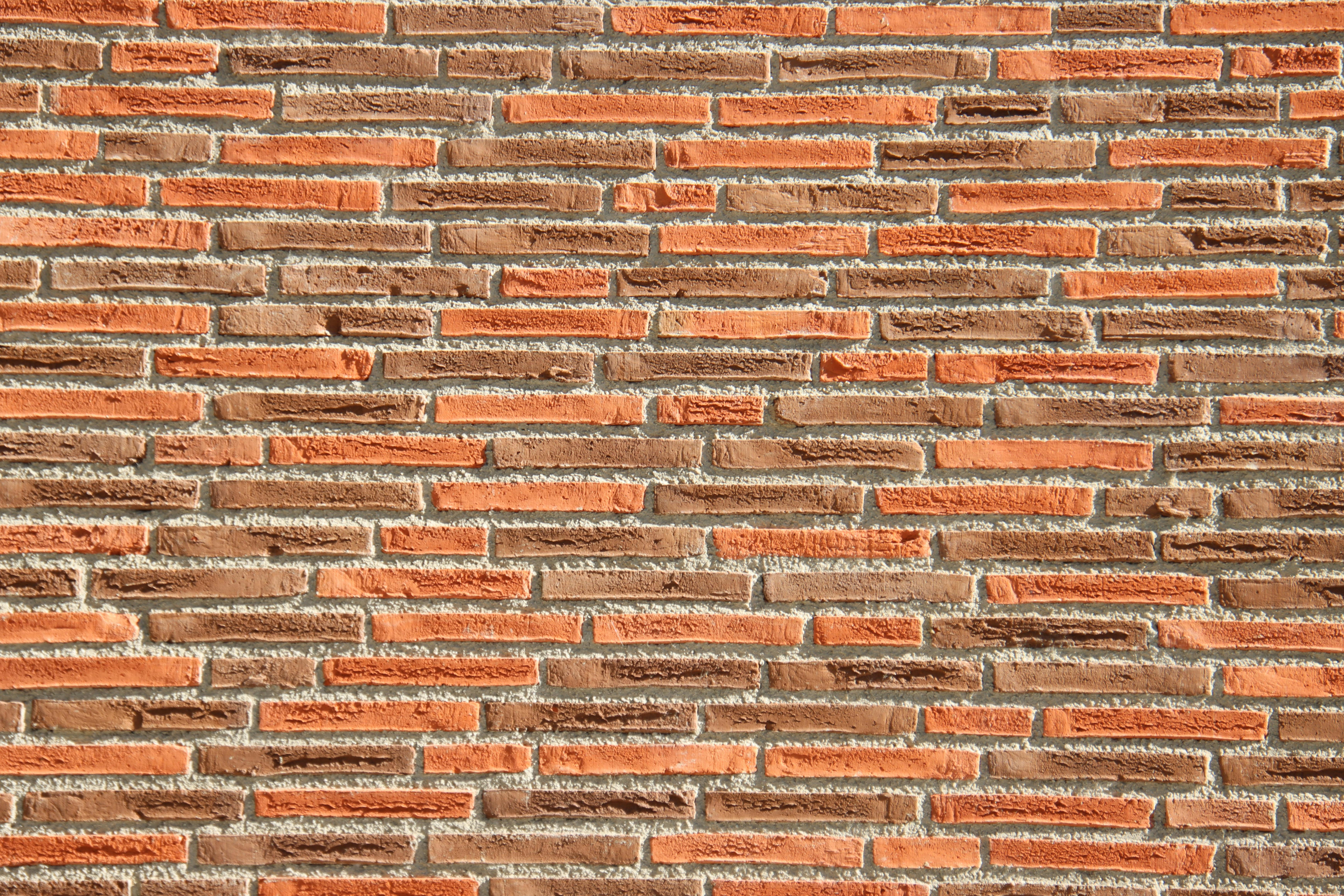 Detailed texture of a red brick wall, perfect for architectural backgrounds.