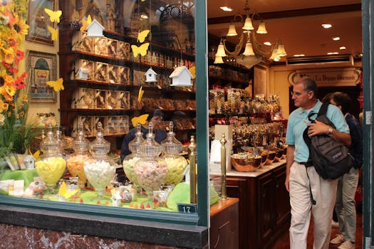 Vibrant Brussels shop window showcasing assorted sweets and chocolates.