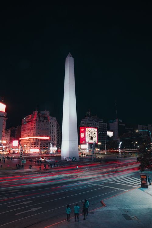 Free Stunning night view of the Obelisco in Buenos Aires with vibrant city lights and light trails. Stock Photo