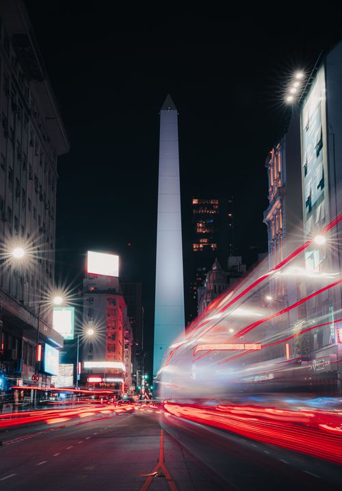 Free Dynamic night scene capturing the iconic Buenos Aires Obelisk with light trails. Stock Photo