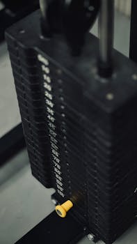 Detailed view of a weight stack on gym equipment for strength training workouts.