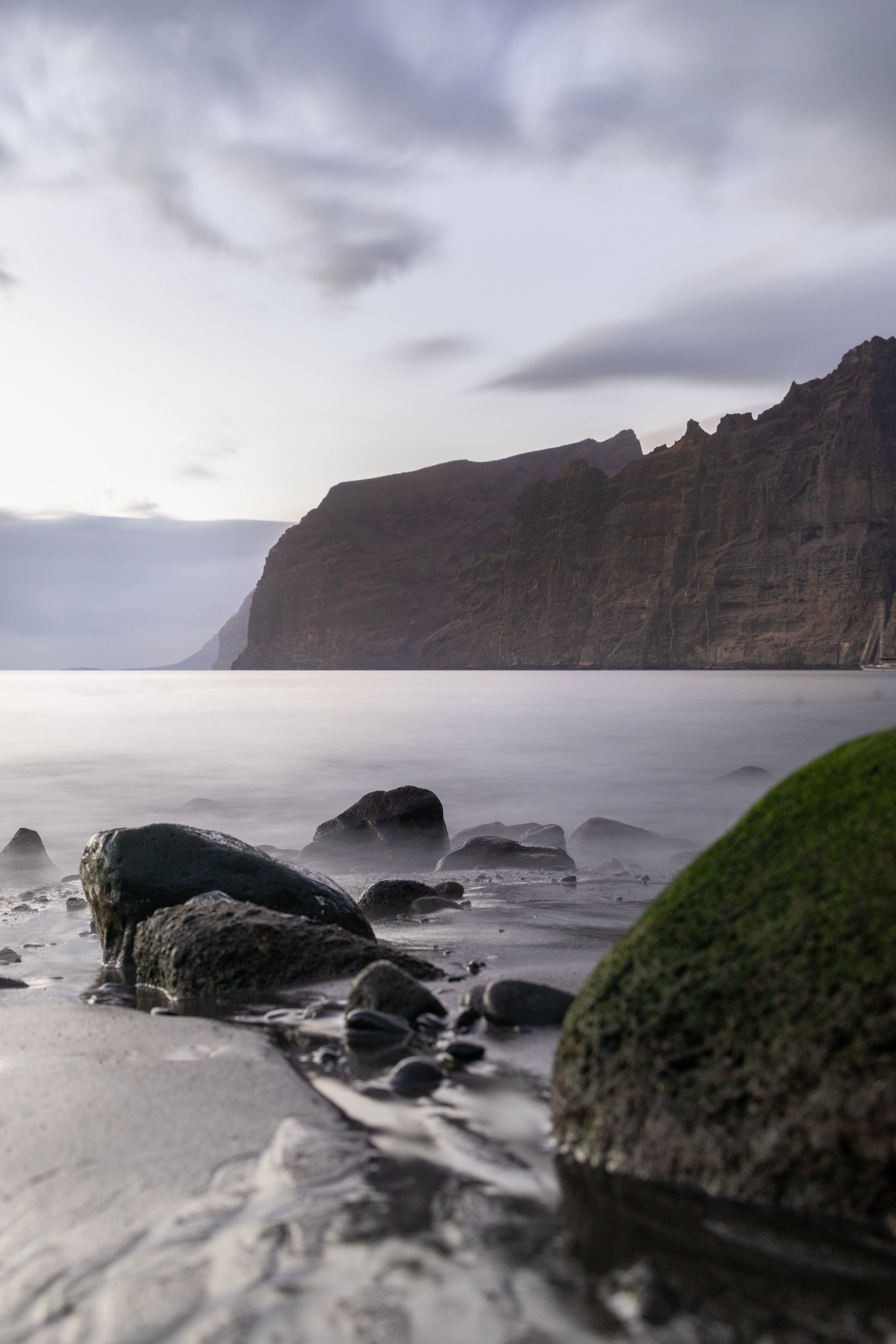 Serene Coastal Landscape with Rocky Shore · Free Stock Photo