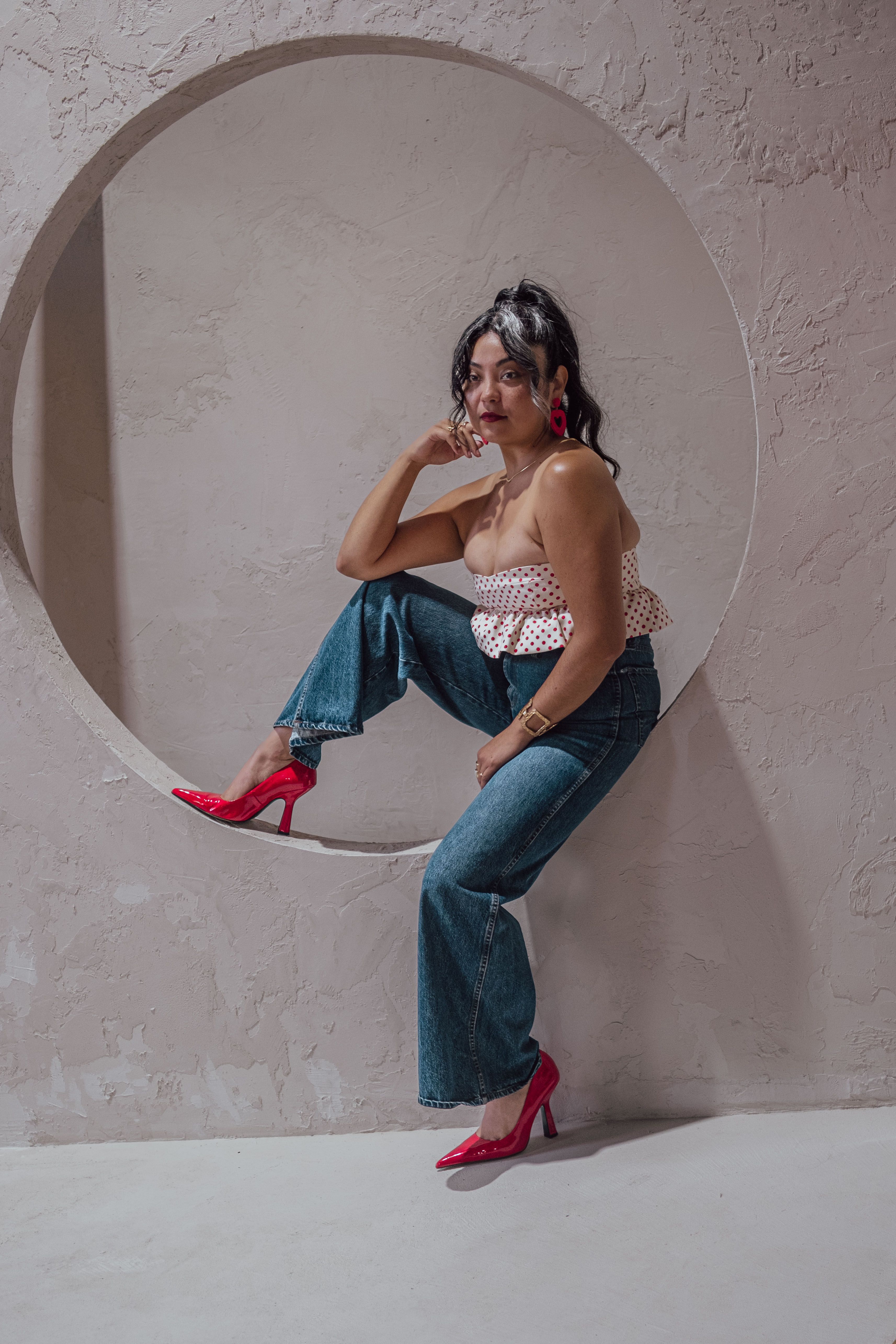 Stylish Woman Posing in Modern Indoor Setting · Free Stock Photo