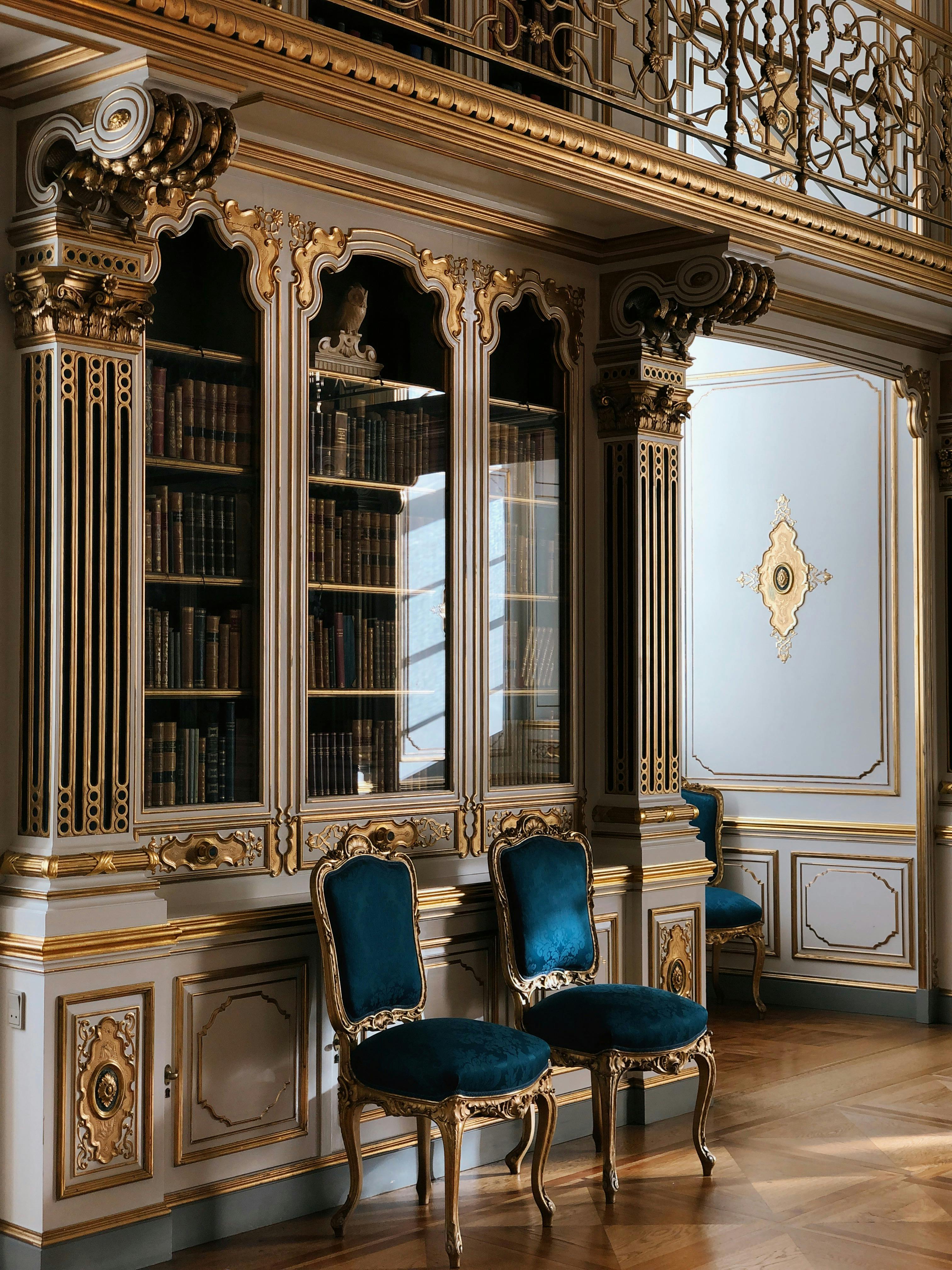 Luxurious Baroque style library with ornate chairs in Copenhagen, Denmark.