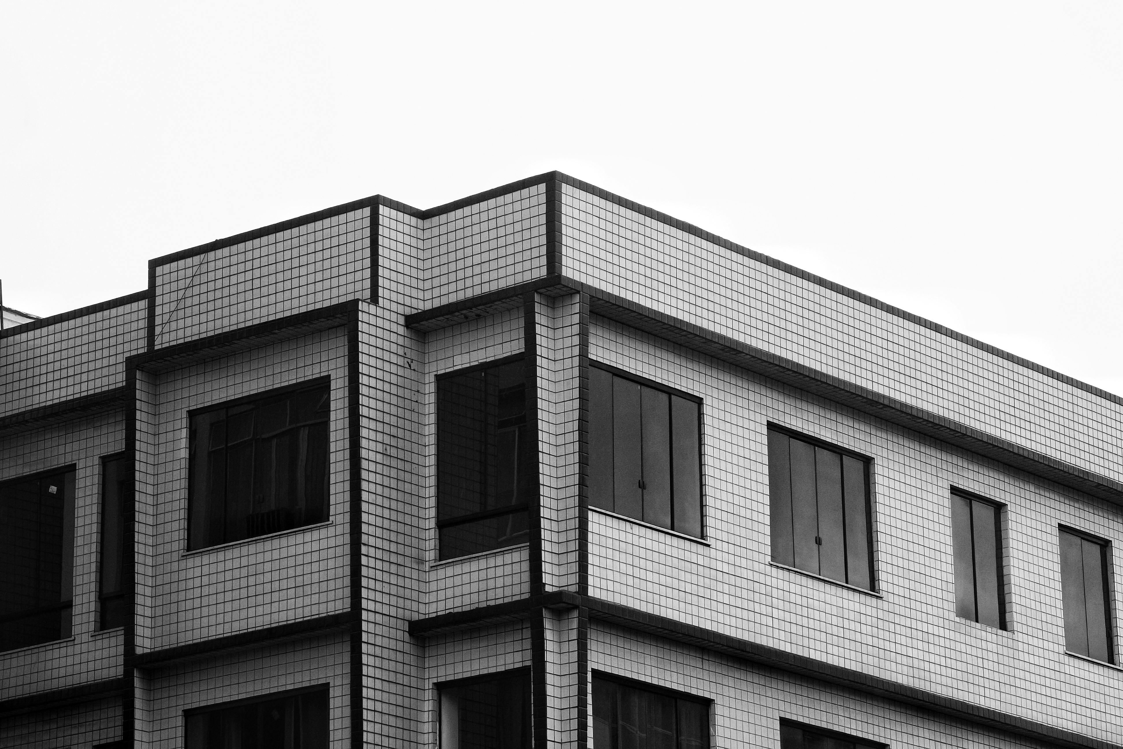 Free Black and white photo of modern building facade with geometric design. Stock Photo