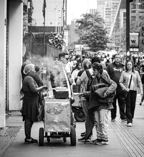 Free Busy street vendor in São Paulo capturing urban life and interactions. Stock Photo